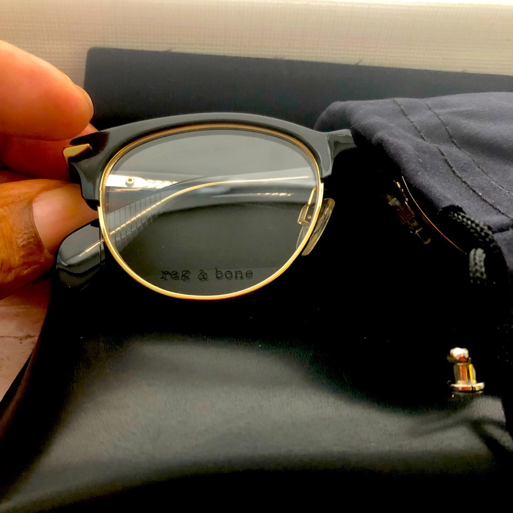 Designer Eye glasses.  Black, gold trim, non prescription lenses.